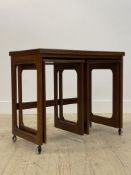 McIntosh, a mid century teak occasional table, the fold over revolving top above two suspended