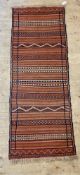 A flat weave runner rug of geometric and lineal design 196cm x 70cm
