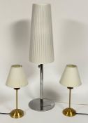 A contemporary chrome plated table lamp with white pleated shade (H86cm) together with a pair of