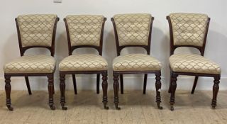 A set of four mid 19th century mahogany dining chairs, the scrolled show frame enclosing upholstered