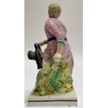 An early nineteenth century Staffordshire pottery pearlware figure of Elijah and the ravens on a