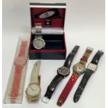 A group of wristwatches comprising a boxed Swiss Sports quartz chronograph, a pink dial Swatch in