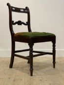 An early 19th century mahogany side chair, with scrolled rail back over drop in upholstered seat