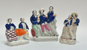 A 19thc Staffordshire figure of a gentleman and lady seated at a table (h- 16cm) (hairline crack