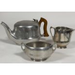A Vintage Picquot ware aluminium three piece tea set, the tea pot with treen handle to side, (h x