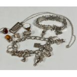A collection of silver jewellery including an oval spiral link charm bracelet with thirteen