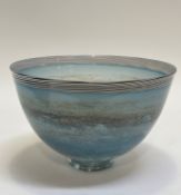 A Lindean Mill hand-blown footed blue glass bowl decorated with a stripy black and white rim. (h-