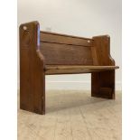 A late 19th century pitch pine pew or hall bench, H87cm, W123cm, D53cm