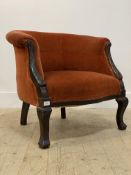 A late Victorian tub chair, upholstered in red velvet, with a scroll and acanthus carved show frame,