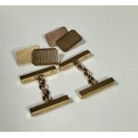 A pair of 9ct gold rectangular engine turned sleeve links, unascribed, (l x 1.6cm x 0.8cm) and a