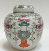 A Chinese porcelain falancai/famille rose enamelled ginger jar depicting lotuses and hanging motifs,