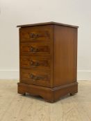 A reproduction yew wood LP cabinet, with hinged top over four dummy drawers, raised on bracket