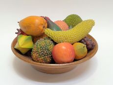 A turned treen bowl of artificial fruit comprising several items with metal studded nodules