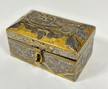 An Middle Eastern minature brass jewellery casket of domed form with white metal overlaid script and