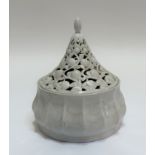 A white ceramic pagoda style serving dish with pierced cover decorated with fruit. (h- 22cm w- 15.