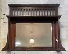An Early 20th century mahogany over mantel mirror, with open shelf on turned pilasters enclosing a