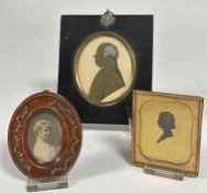 A 19thc silhouette portrait miniature of a gentleman highlighted with ink and white chalk in
