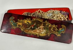An Edwardian rectangular papier mache lacquered glove box with central panel of seated lady and