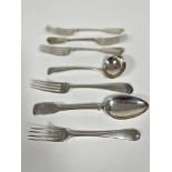 A set of three Victorian London silver fiddle pattern table forks, engraved with crest, (lx21cm)