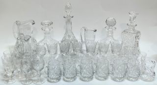 A mixed group of cut crystal comprising four decanters (tallest h- 35cm including stopper), three