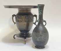 A Chinese/Japanese bronze tripod censer decorated with taotie masks with a wide insert for Ikebana