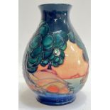 A Moorcroft pottery 'Mamoura' vase of globular form with tube lined decoration of trees and water (