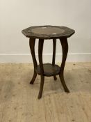 An early 20th century stained fruitwood side table, the octagonal top with floral incise carved