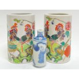 A pair of modern polychrome enamelled Chinese porcelain brush pots depicting exotic/mythical birds