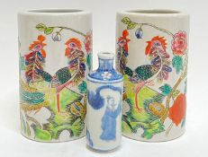 A pair of modern polychrome enamelled Chinese porcelain brush pots depicting exotic/mythical birds