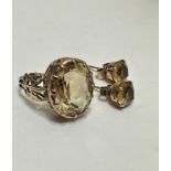 A 9ct gold dress ring set oval faceted citrine mounted in claw setting with open work shoulders,