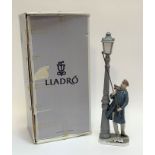 A Lladro glazed figure of a Lamplighter with original box (h- 67 w-13cm) (crack/repair made to