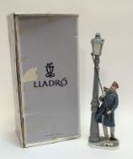 A Lladro glazed figure of a Lamplighter with original box (h- 67 w-13cm) (crack/repair made to