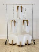 A set of three vintage beech and opalescent acrylic pendant light fittings, (H53cm) together with