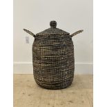 A twin handled woven laundry basket with knop to lid H66cm