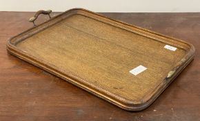 An early 20th century twin handled oak drinks tray 56cm x 39cm