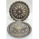 A pair of Indo-Persian niello trays, possibly Kashmiri, decorated with scrolling foliate motifs on a