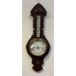 A Victorian oak cased banjo pattern aneroid barometer and thermometer, with white ceramic