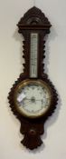 A Victorian oak cased banjo pattern aneroid barometer and thermometer, with white ceramic