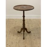 A Victorian mahogany wine table, the circular tray top raised on turned column and triple splay