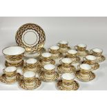 A English China part tea service with floral sprays and gilt decoration comprising a large bowl (h-