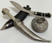 A mixed group of tourist wares comprising a kukri dagger set and leather scabbard (also including