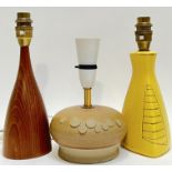 A group of three lamp bases comprising a squat form studio pottery lamp base with applied bubble