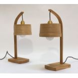 Tom Raffield, a pair of contemporary oak table lamps, each with a bentwood shade on a bowed