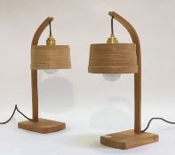 Tom Raffield, a pair of contemporary oak table lamps, each with a bentwood shade on a bowed