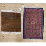 A small flat weave kilim rug, (90cm x 56cm) together with a full pile rug of lineal design (65cm x