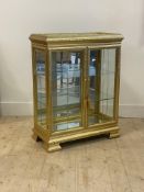 A Versailles style gilt wood and composition pier cabinet, with mirrored top over glazed sides and