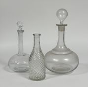 A group of three decanters a magnum wine decanter (h-37cm), a liquor decanter (chips to stopper) (h-