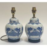A pair of blue and white ginger jar style table lamps decorated with a dragon scene (h- 25cm)