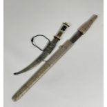 A Middle Eastern dagger, with horn and bone decorative handle, curved blade in metal covered