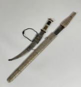 A Middle Eastern dagger, with horn and bone decorative handle, curved blade in metal covered